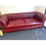 AN AS NEW LEATHER BUTTON BACK CHESTERFIELD SETTEE