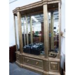 A LARGE GILT DECORATED DISPLAY CABINET.