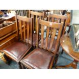 A SET OF OAK DINING CHAIRS.