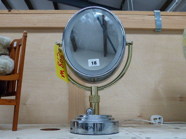 A REVLON MAKE UP MIRROR.