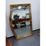 A LARGE MARGINAL FRAMED MIRROR.