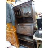 A SMALL OAK BUREAU BOOK CASE.