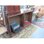 A LOW OAK BOOKCASE.