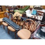 A SET OF ERCOL DINING CHAIRS.