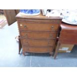 A SMALL WALNUT BOW FRONT CHEST.