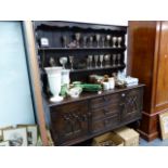 AN OAK DRESSER AND RACK.