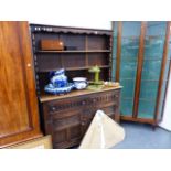 AN OAK DRESSER AND RACK.