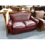 AN AS NEW ART DECO STYLE TWO SEAT LEATHER SETTEE.