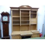 A BREAKFRONT BOOKCASE CABINET.