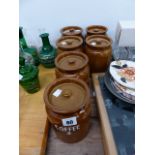 A SET OF SIX STORAGE JARS.