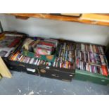 A LARGE QTY OF DVDS AND CDS.