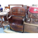 A MAHOGANY COMMODE.