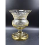 A CUT CLEAR GLASS THISTLE SHAPED VASE ON STAR CUT FOOT. H.25.5CMS.