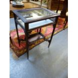 AN EDWARDIAN MAHOGANY CARVED BIJOUTERIE TABLE WITH UNDERTIER ON SLENDER TAPERED LEGS. W.58 X H.