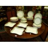 AN IVORY POTTERY PART DINNER SERVICE DECORATED WITH GREEN OAK LEAF RIM BANDS. APPROX. 45 PIECES.