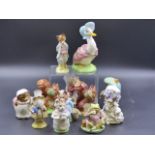 TWELVE BESWICK BEATRIX POTTER FIGURES WITH GOLD BACK STAMPS.