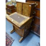 AN INLAID WALNUT DAVENPORT DESK OF UNUSUAL CONFIGURATION, TWO DOOR FITTED CABINET ABOVE LEATHER