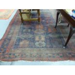C. AN ANTIQUE BELOUCH MAIN CARPET. 382 X 258CMS TOGETHER WITH A SMALL BELOUCH RUG.