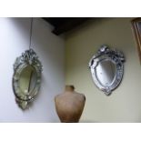 TWO VENETIAN STYLE MIRRORS, ONE OVAL, THE OTHER SHIELD SHAPE. LARGEST H. 76CMS.