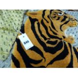 A SILK PANEL APPLIED WITH A PLUSH FIGURE OF A TIGER WITHIN A LEOPARD SKIN BAND EDGING.
