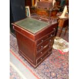 AN EARLY VICTORIAN MAHOGANY DAVENPORT DESK, ADJUSTABLE TOP WITH GALLERY BACK ABOVE INSET LEATHER