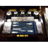 A MID VICTORIAN CALAMANDER WOOD DRESSSING CASE WITH SILVER FITTINGS BY WILLIAM NEAL, THE SPRING