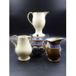 A CREAMWARE TEAPOT AND MATCHING JUG PRINTED IN BLUE ON A BROWN GROUND TOGETHER WITH TWO CREAMWARE