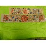 TWO CHINESE EMBROIDERED WHITE SILK SLEEVE PANELS.
