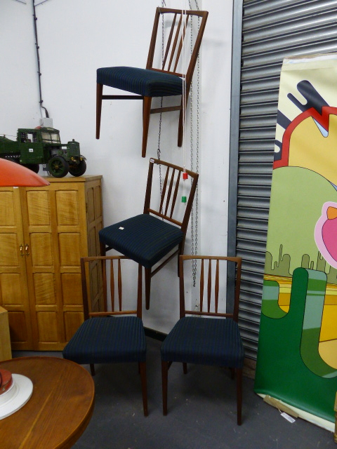 A SET OF FOUR MID CENTURY TEAK DINING CHAIRS.