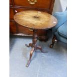 A COUNTRY OAK LATE GEORGIAN LAMP TABLE WITH CIRCULAR TOP AND TRIFID SCROLL LEGS WHICH END IN PAD