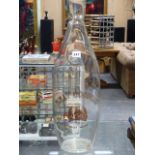 AN ETCHED CLEAR GLASS TOLLY COBBOLD SHOP DISPLAY BOTTLE. H.62CMS.