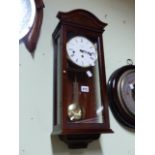 A COMITTI GLAZED MAHOGANY WALL CLOCK, THE MOVEMENT WITH CHIMES AND STRIKE ON FIVE RODS ABOVE THE