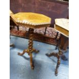 A VICTORIAN CARVED WALNUT OCTAGONAL LAMP TABLE WITH SPIRAL PEDESTAL TRIFID SCROLL LEGS.