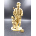 A JAPANESE SECTIONAL MARINE IVORY GROUP OF FATHER AND SON HARVESTING FOOD, SIGNED. H.21CMS.