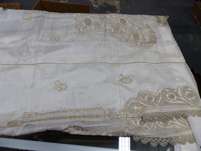 AN ALBANIAN WHITE SILK WEDDING DRESS WORKED WITH FLOWERS IN SILVER THREAD LACEWORK AND PALE - Image 5 of 6