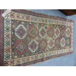 AN ANTIQUE CAUCASIAN RUG. 227 X 122CMS.