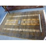 AN ORIENTAL RUG OF TURKOMAN DESIGN. 248 X 160CMS.