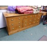 A LARGE VINTAGE AND LATER COUNTRY PINE NINE DRAWER SIDE CABINET. W.221 X D.80 X H.94CMS.