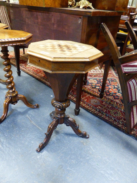 A VICTORIAN CARVED AND INLAID ROSEWOOD WORK TABLE WITH OCTAGONAL TOP INLAID WITH GAMEBOARD ON TRIFID