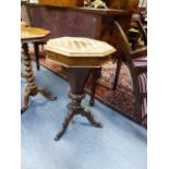 A VICTORIAN CARVED AND INLAID ROSEWOOD WORK TABLE WITH OCTAGONAL TOP INLAID WITH GAMEBOARD ON TRIFID