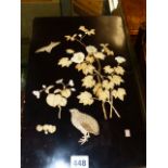 A JAPANESE BLACK LACQUER PLAQUE INLAID WITH A SMALL BIRD FLYING DOWN TO A QUAIL BELOW A HIBISCUS