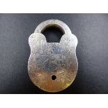 A NICKEL PADLOCK WITH NAIVE ENGRAVED SCENIC DECORATION. MEASUREMENTS 8.5CMS.