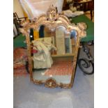 A GILT GEORGIAN STYLE MIRROR WITH SHELL AND SCROLL WORK FRAME. W.82 X H.116CMS.