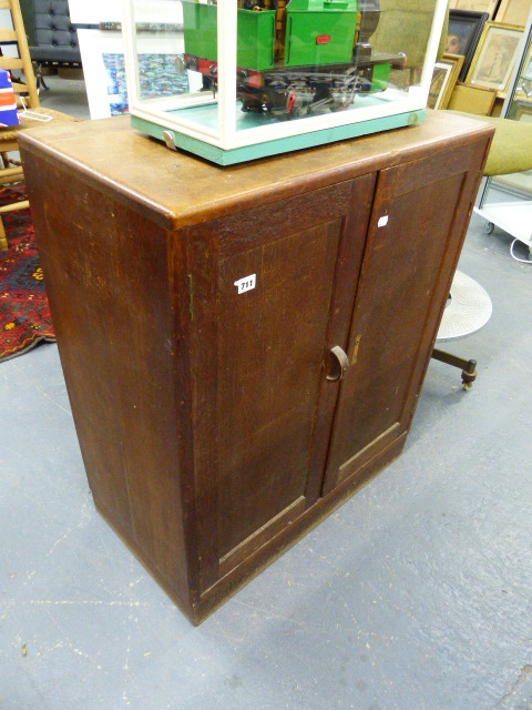 A HEAL'S ART DECO STYLE OAK TWO DOOR CABINET. 76 X 91CMS.