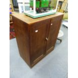 A HEAL'S ART DECO STYLE OAK TWO DOOR CABINET. 76 X 91CMS.