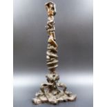AN ANTIQUE CONTINENTAL BRONZE FIGURAL STAND THE COLUMN OF ENTWINED FIGURES AND A SERPENT SUPPORTED