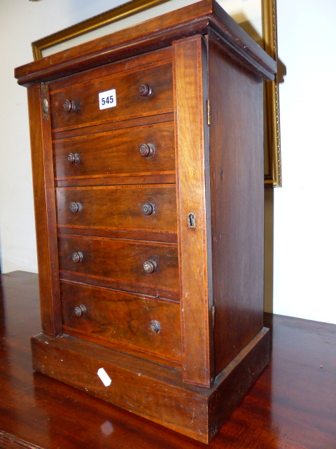 A VICTORIAN INLAID WALNUT FIVE DRAWER TABLE TOP WELLINGTON CHEST ON PLINTH BASE. W.34 X H.49CMS.