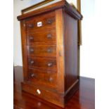 A VICTORIAN INLAID WALNUT FIVE DRAWER TABLE TOP WELLINGTON CHEST ON PLINTH BASE. W.34 X H.49CMS.