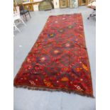 A TRIBAL PERSIAN / AFGHAN RUG. 390 X 160CMS.