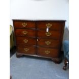 A BESPOKE CARVED MAHOGANY CHIPPENDALE STYLE CHEST WITH AN UNUSUAL ARRANGEMENT OF TWO BANKS OF FOUR